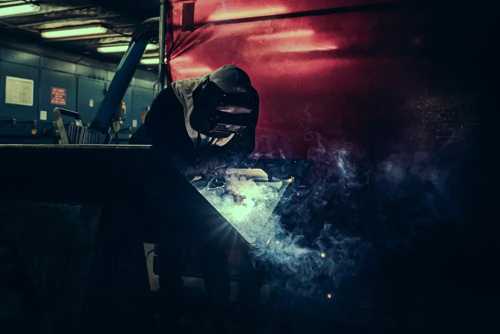 A welder performs a precision weld at Pearl Harbor Naval Shipyard and Intermediate Maintenance Facility, Hawaii, May 5, 2025.