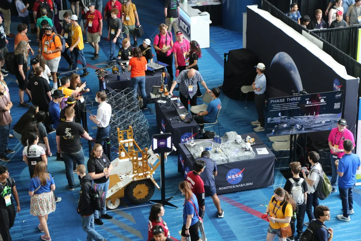 Visitors explore NASA’s technology exhibits at the 2026 FIRST Robotics World Championship in Houston.